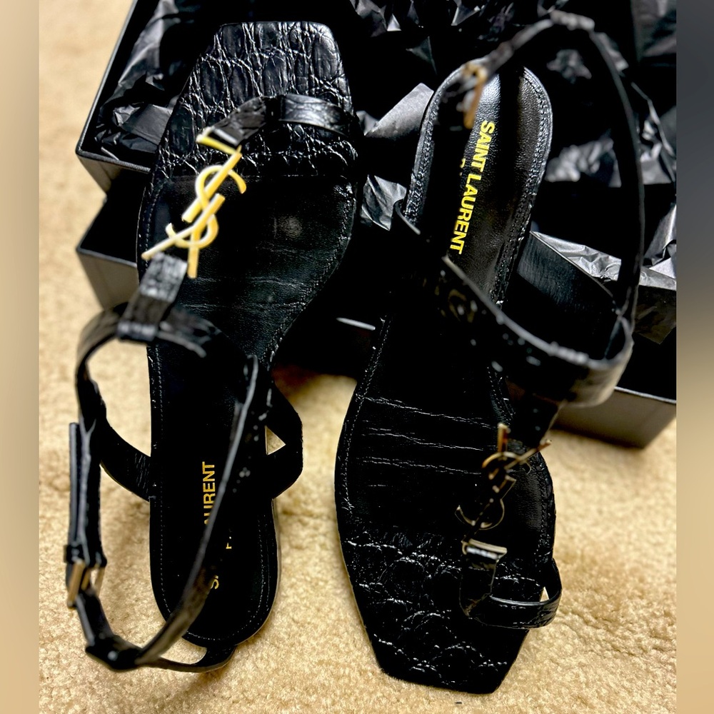 Black YSL sandals.